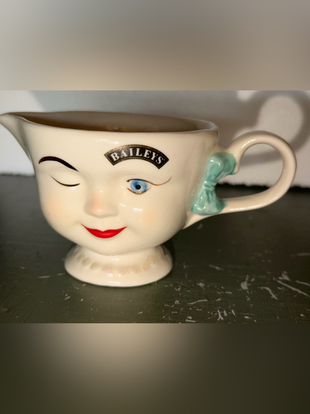 Cream Ceramic Teacup with Light Blue Accent